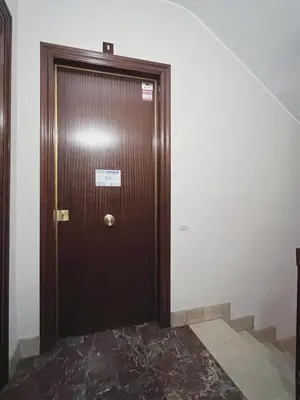 a wooden door with a sign on it in a room at Stay U-nique Apartments Diagonal in Barcelona