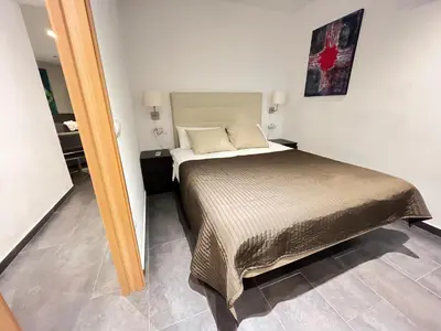 a bedroom with a bed in a room at GORGEOUS APARTMENT IN DOWNTOWN in Barcelona