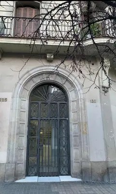 an entrance to a building with a wrought iron door at GORGEOUS APARTMENT IN DOWNTOWN in Barcelona