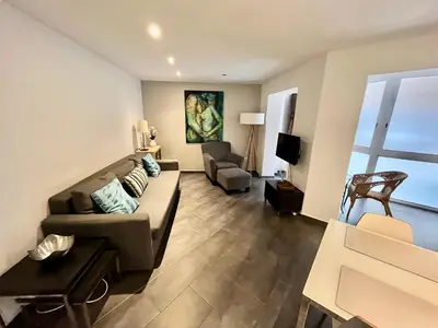 a living room with a couch and a chair at GORGEOUS APARTMENT IN DOWNTOWN in Barcelona