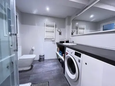 a bathroom with a toilet sink and a washing machine at GORGEOUS APARTMENT IN DOWNTOWN in Barcelona