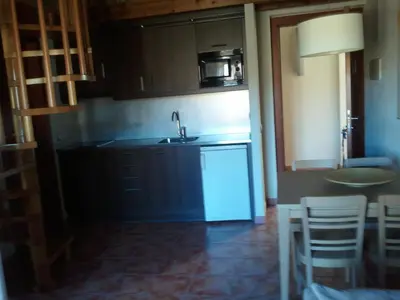 a kitchen with a sink and a counter top at Can Vilafort in Collsuspina