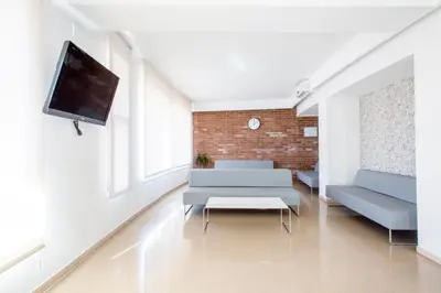 a living room with a couch and a tv at Residencia Universitaria Resa Francesc Giralt i Serrà in Terrassa