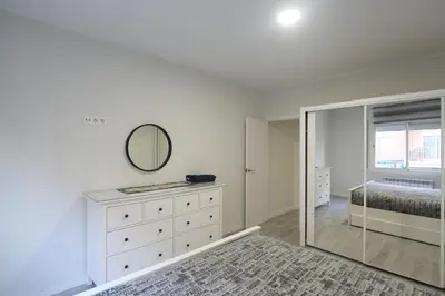 a bedroom with a dresser and a mirror at Nur Apartment in Terrassa