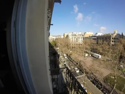 a view of a city street from a balcony at Mr. Serrano Apartments in Barcelona