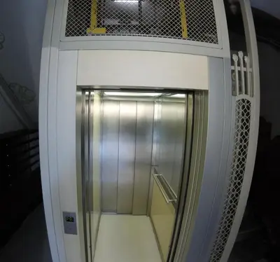 an elevator in a building with its door open at Mr. Serrano Apartments in Barcelona