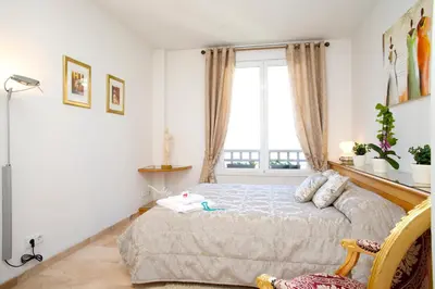 a bedroom with a bed and a window at Lux Apartments Barcelona in Barcelona