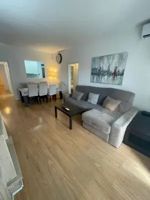 a living room with a couch and a table at Family-Friendly Home in Central Barcelona 4BDR in Barcelona