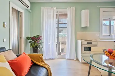 a living room with a couch and a glass table at Easystaybcn2 in Barcelona