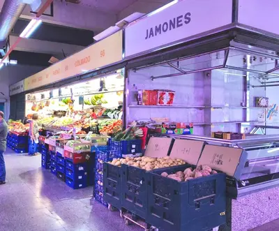 a market with vegetables and fruits in a store at Amazing Badalona Apartment With Terrace in Badalona