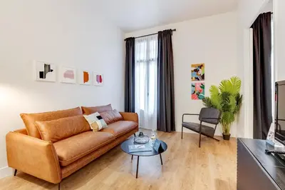 a living room with a couch and a table at Sweett - Sepulveda in Barcelona