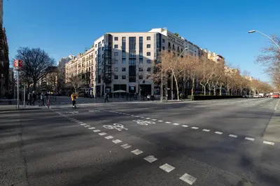an empty street in a city with buildings at Sweett - Sepulveda in Barcelona