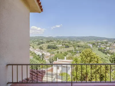 a balcony with a view of a city at Villa in Arenys de Mar with Sea View in Arenys de Mar