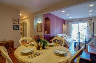 a dining room with a table and chairs at Montroig Zen Penthouse by Hello Homes Sitges in Sitges