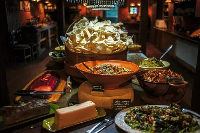 a buffet with many different types of food on a table at El Folló Turisme Rural in Tagamanent