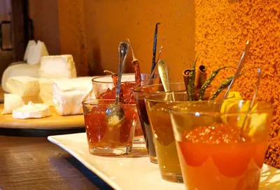 a group of glasses of food on a table at El Folló Turisme Rural in Tagamanent