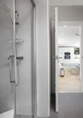 a bathroom with a shower with a glass door at Stay Unique Apartments Aprestadora in Hospitalet de Llobregat
