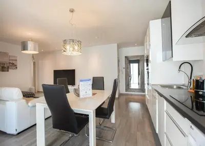 a kitchen and dining room with a table and chairs at Stay Unique Apartments Aprestadora in Hospitalet de Llobregat
