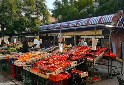 a market with a bunch of fruits and vegetables on display at Mataró Center Apartment in Mataró
