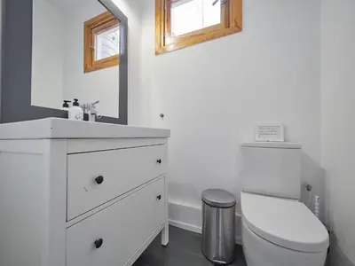 a white bathroom with a sink and a toilet at BarcelonaForRent Alessandra Ramblas in Barcelona