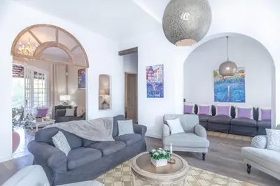 a living room with a couch and chairs at Casa Nova Estate in Sitges