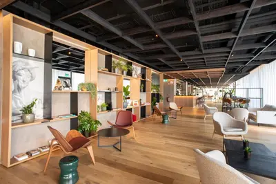 a lobby of a store with chairs and tables at Hotel Paxton Barcelona in Barcelona