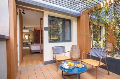 a patio with two chairs and a table at Hotel Paxton Barcelona in Barcelona
