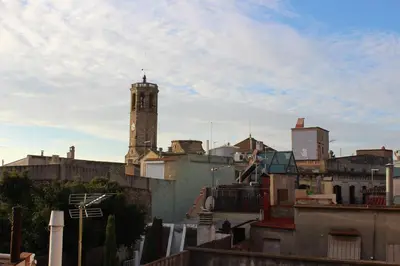 a view of a city with a clock tower at Apartment Graus Barcelona in Barcelona