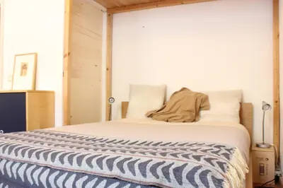 a living room with a couch and some windows at Apartment Graus Barcelona in Barcelona