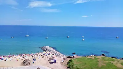 a crowd of people on a beach near the ocean at LIANA SEAVIEW & BEACH - apartment in Montgat