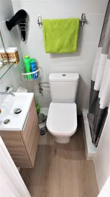 a bathroom with a white toilet and a sink at LIANA SEAVIEW & BEACH - apartment in Montgat