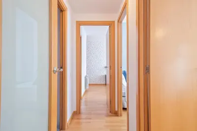 a hallway with two doors leading to a room at Alcam Rubi in Rubí