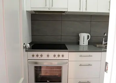 a kitchen with a stove and a sink at Vinyet Sitges in Sitges