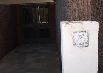 a sign for a building with a bird on it at Vinyet Sitges in Sitges