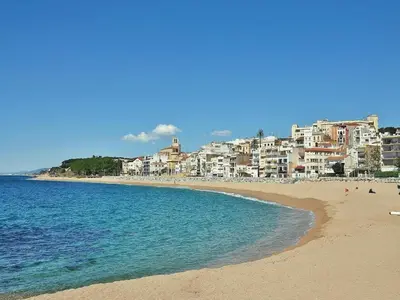 a view of a beach with buildings in the background at Villa in Sant Pol near Crystal Beach in San Pol de Mar