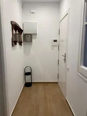 a room with a hallway with a door and a wooden floor at VIU BARCELONA BERTRAN in Barcelona