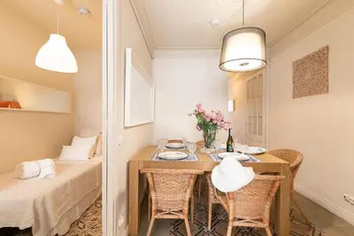 a small dining room with a table and chairs at Urban Apartments in Barcelona