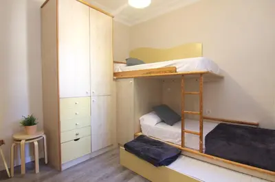 a bedroom with a bunk bed and a closet at FELIP - Spacious and quiet apartments & one with Terrace in Barcelona