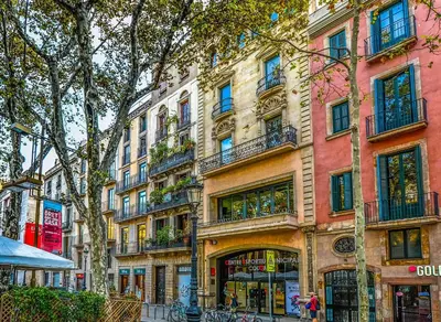 a tall building with balconies on a city street at FELIP - Spacious and quiet apartments & one with Terrace in Barcelona