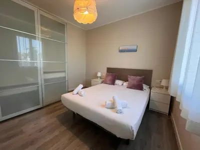 a bedroom with a bed with towels on it at RIUS - Apartments & one Penthouse with private terrace in Montjuic in Barcelona