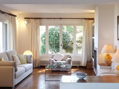 a living room with two couches and a large window at Holiday Home La Marina Blanca by Interhome in San Pol de Mar