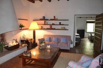 a living room with a couch and a table at Mas Peirot Sitges in Cunit