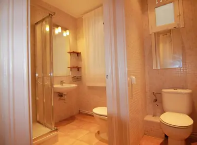 a bathroom with a toilet and a sink at CORSEGA - Apartment in the center of Barcelona in Barcelona