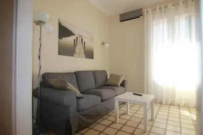 a living room with a couch and a table at CORSEGA - Apartment in the center of Barcelona in Barcelona