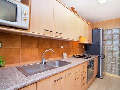 a kitchen with a sink and a microwave at Apartment Edificio Blanqueries by Interhome in Calella