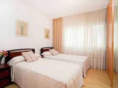 a hotel room with two beds and a window at Apartment Edificio Blanqueries by Interhome in Calella