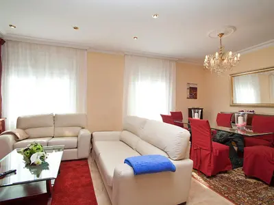 a living room with white furniture and a chandelier at Apartment Pg Gracia - Valencia by Interhome in Barcelona