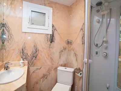 a bathroom with a toilet and a sink at Apartment Pg Gracia - Valencia by Interhome in Barcelona