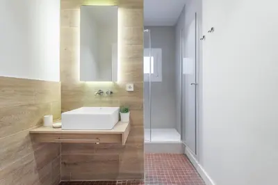 a bathroom with a sink and a shower at Flateli Pelayo H5 in Barcelona