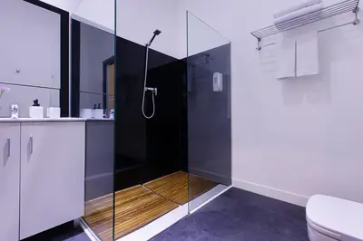 a bathroom with a shower and a toilet at Amra Barcelona Caspe in Barcelona